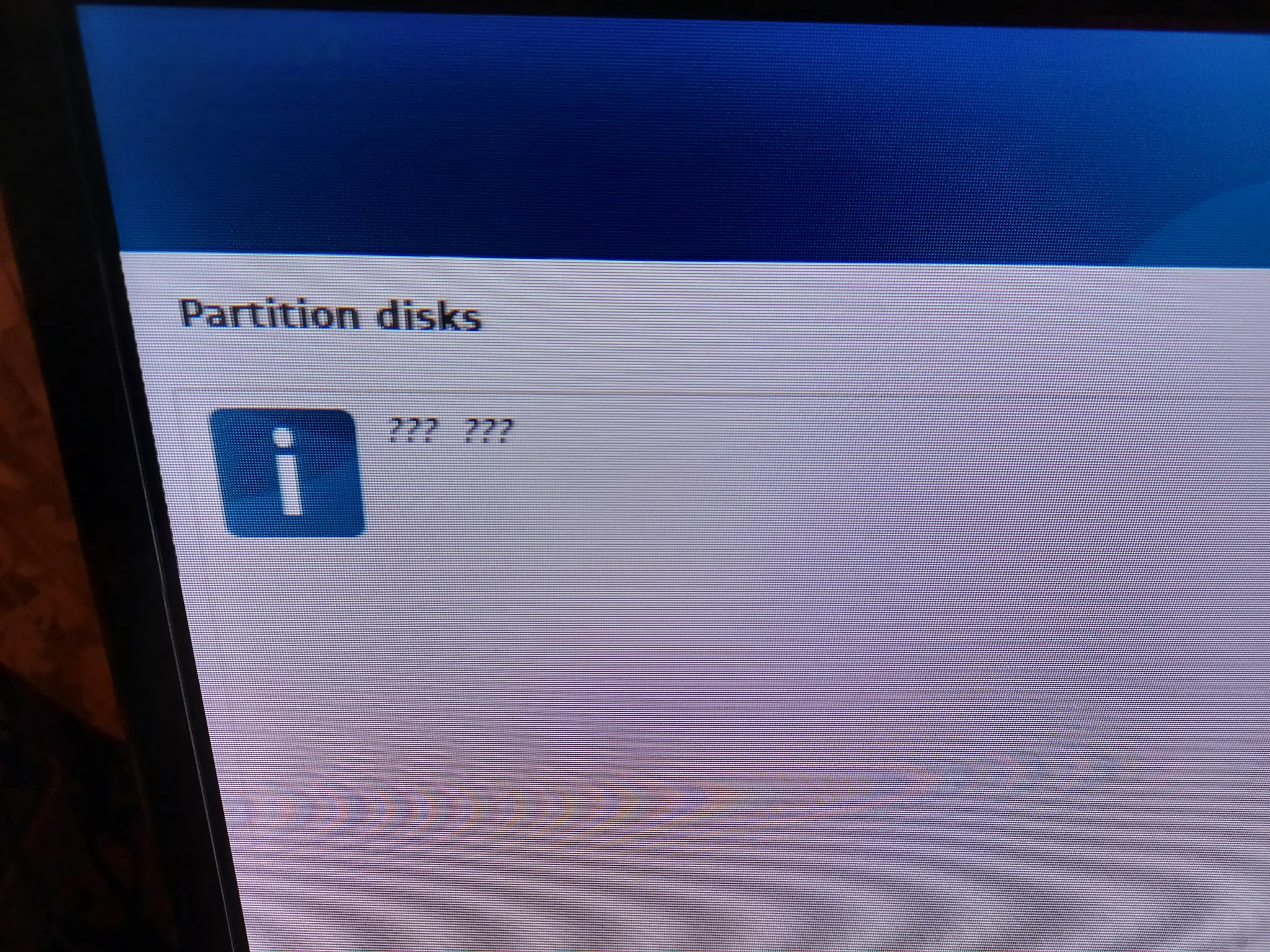 picture of a big screen tv showing the debian 13 installer

i am at the partition disks step
there is an info screen with the text "??? ???" italicized